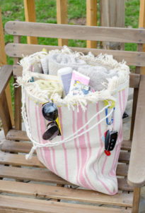 Make a small IKEA rug into a beach bag